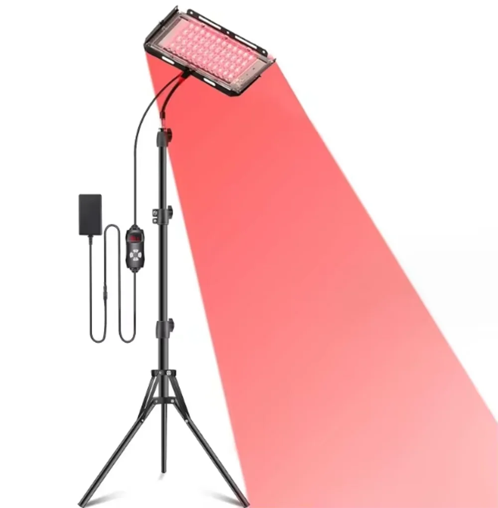 Red light therapy lamp with adjustable stand for full body care.