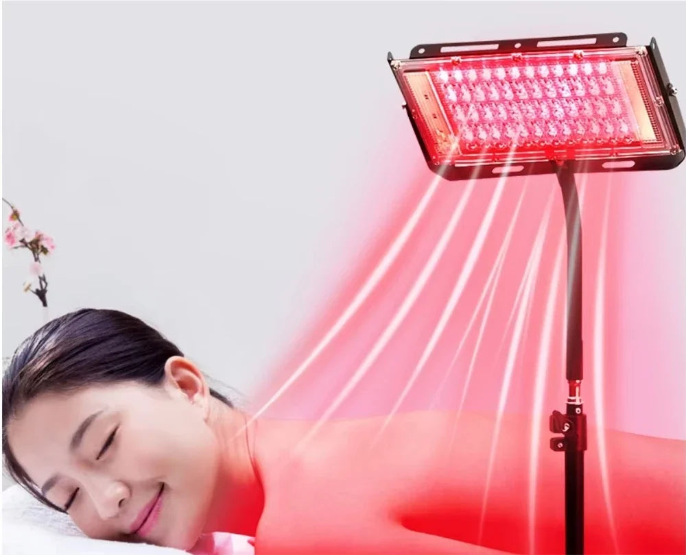 Red light therapy lamp with adjustable stand for full body care.