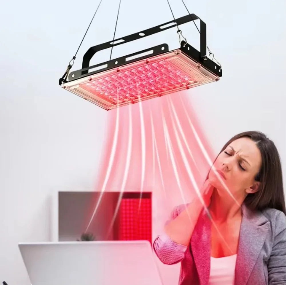 Red light therapy lamp with adjustable stand for full body care.